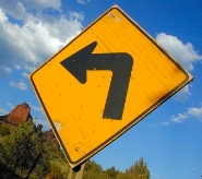 Photograph of a left turn sign