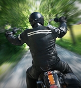 Photograph of two people on a motorcycle