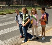 Photograph of kids using a crosswalk